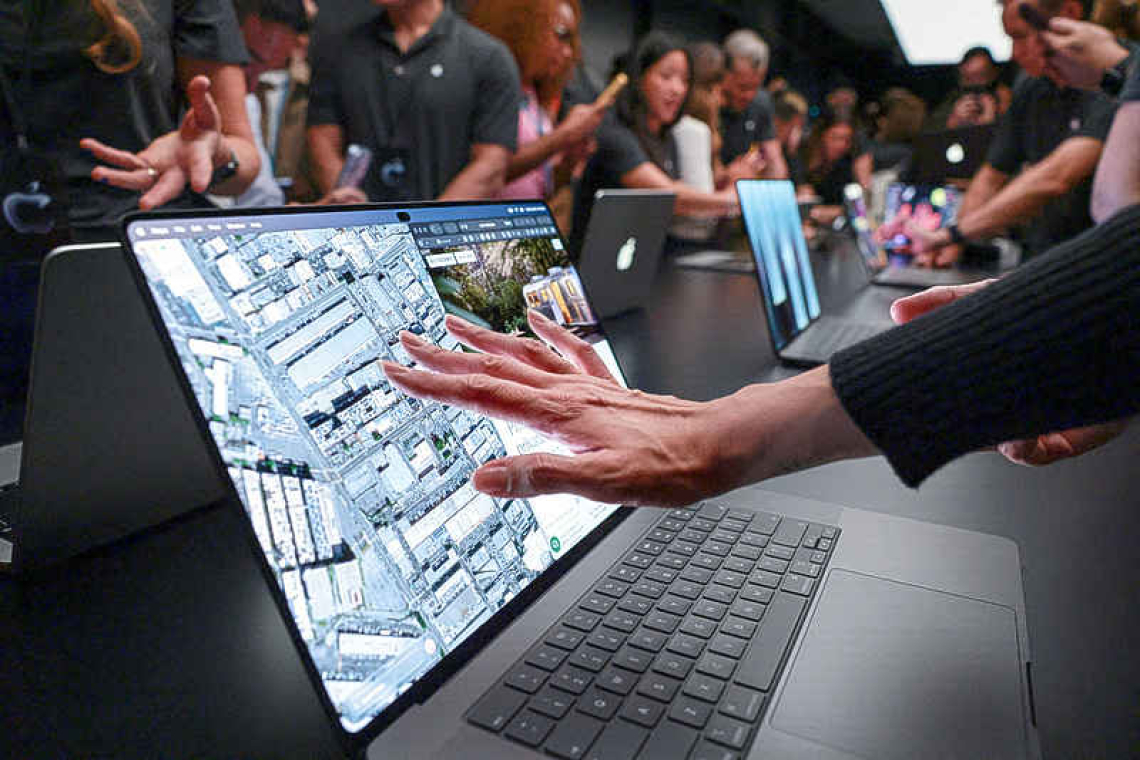 Apple shows pricey touchscreen  laptops, a first for iPhone maker